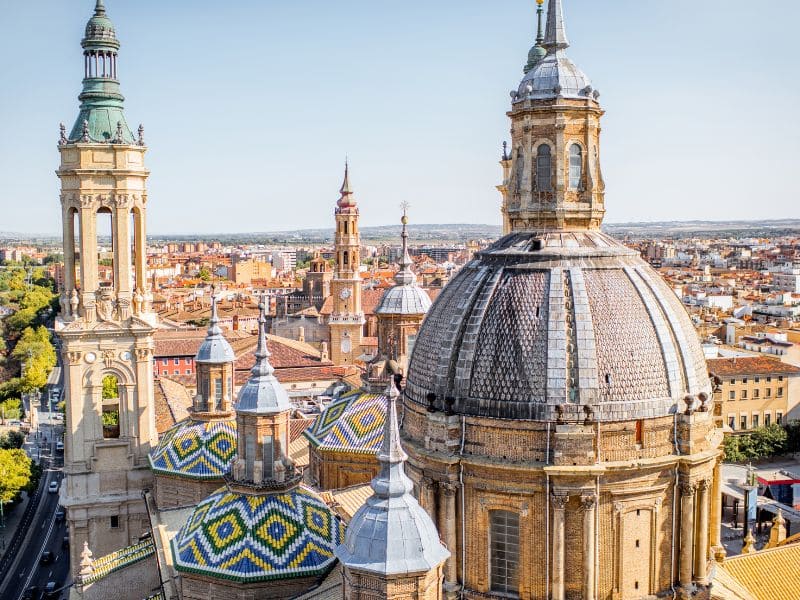 Student housing in Zaragoza: an aerial view over the domes of the Pilar Basilica and the city's neighbourhoods